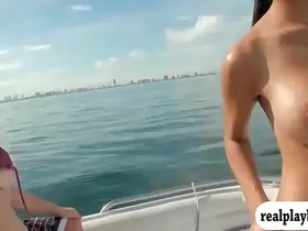 Two sexy girls enjoyed foursome action on speed boat