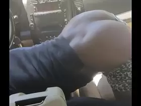 Black Slut Keeps Dick in her Mouth While Shaking Her Ass In Car